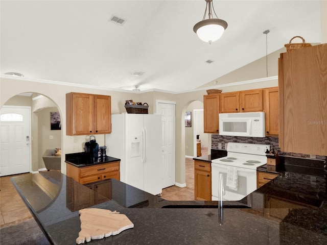 kitchen with light tile patterned flooring, lofted ceiling, pendant lighting, white appliances, and backsplash