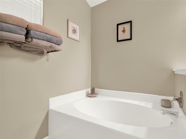 bathroom with a washtub