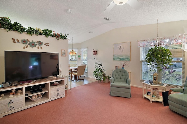 carpeted living room featuring vaulted ceiling, ceiling fan, and a textured ceiling