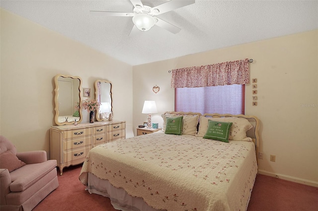 carpeted bedroom with ceiling fan and a textured ceiling