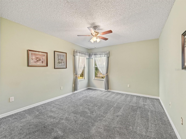 carpeted empty room with a textured ceiling and ceiling fan