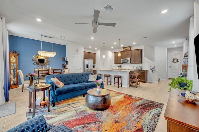 living area with recessed lighting and visible vents