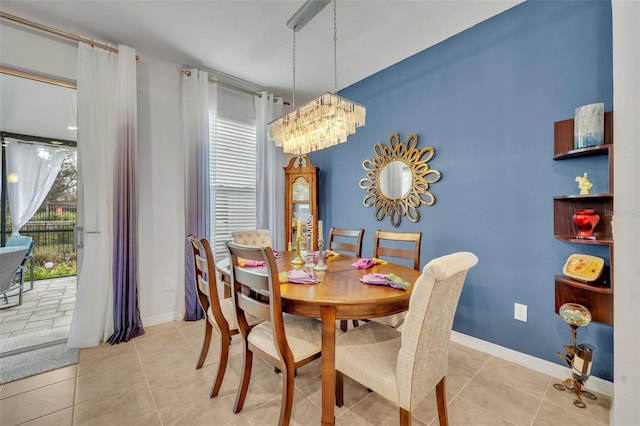 dining area featuring baseboards and light tile patterned flooring