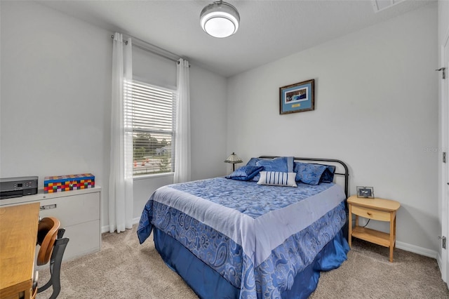 carpeted bedroom featuring baseboards