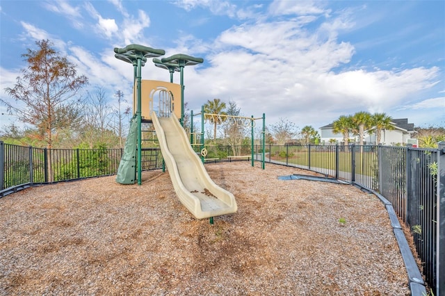 communal playground featuring fence