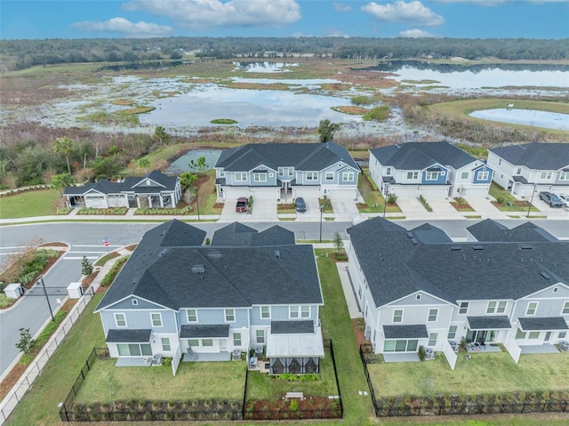 bird's eye view with a residential view and a water view