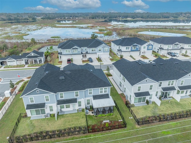 bird's eye view with a residential view and a water view