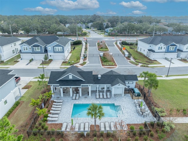 birds eye view of property with a residential view