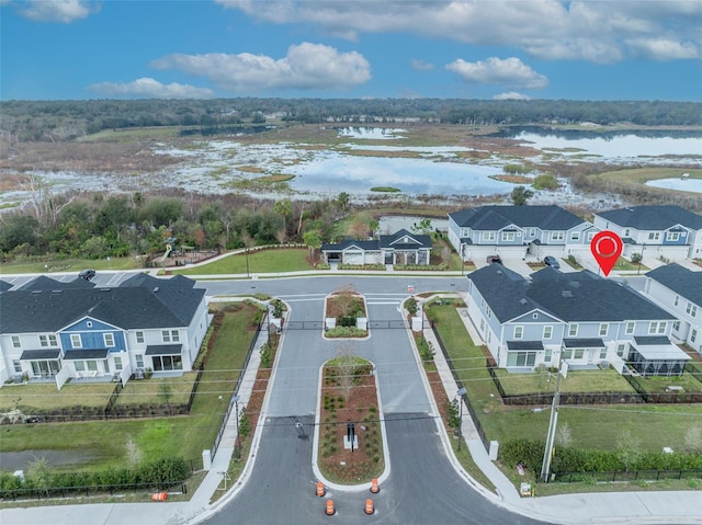 aerial view featuring a residential view and a water view