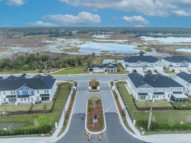 birds eye view of property featuring a residential view and a water view