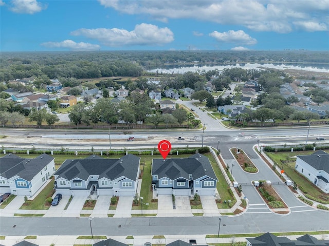 aerial view featuring a residential view and a water view