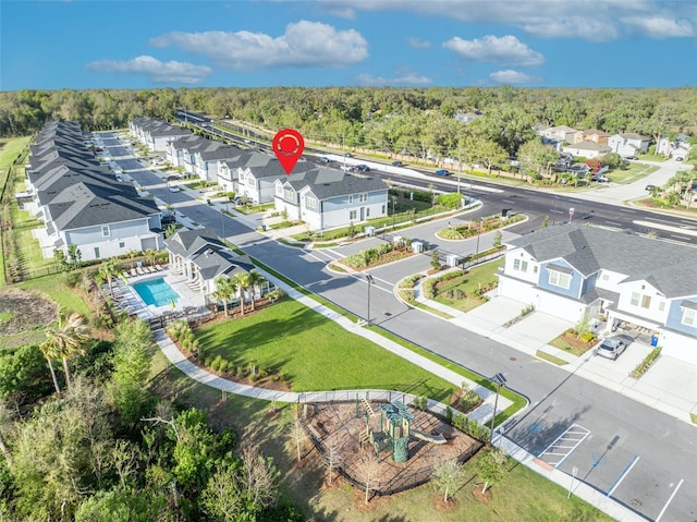 bird's eye view featuring a residential view and a forest view