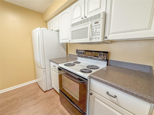 kitchen with white cabinetry, white appliances, a textured ceiling, and light wood-type flooring