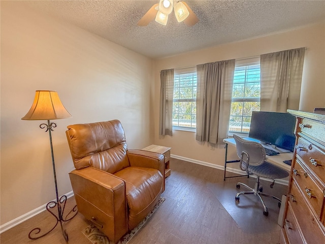 office space with ceiling fan, dark hardwood / wood-style floors, and a textured ceiling