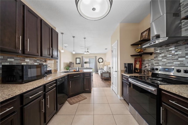 kitchen with light tile patterned floors, backsplash, black appliances, island exhaust hood, and decorative light fixtures