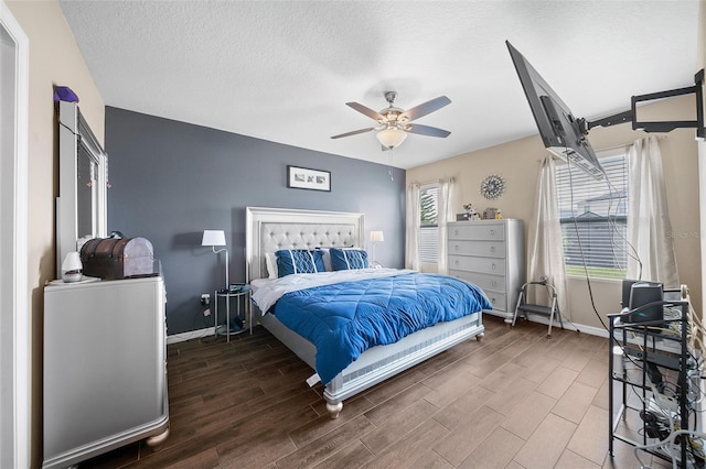 bedroom with a textured ceiling and ceiling fan