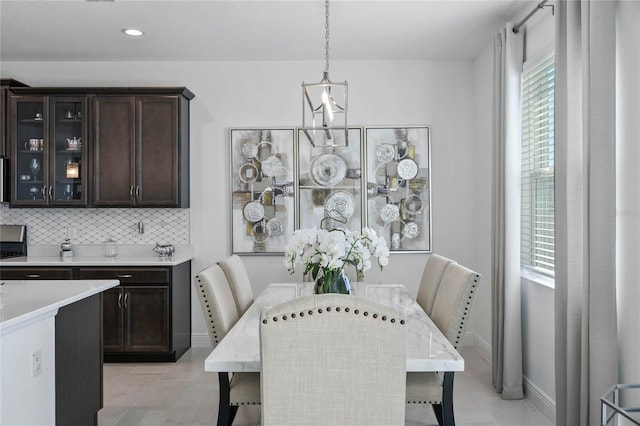 dining area with light tile patterned floors