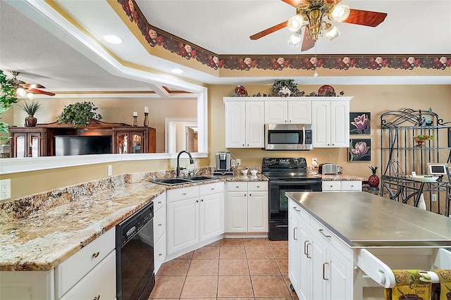 kitchen featuring light tile patterned flooring, sink, black appliances, kitchen peninsula, and white cabinets