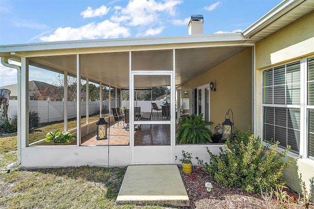 view of patio / terrace featuring a sunroom