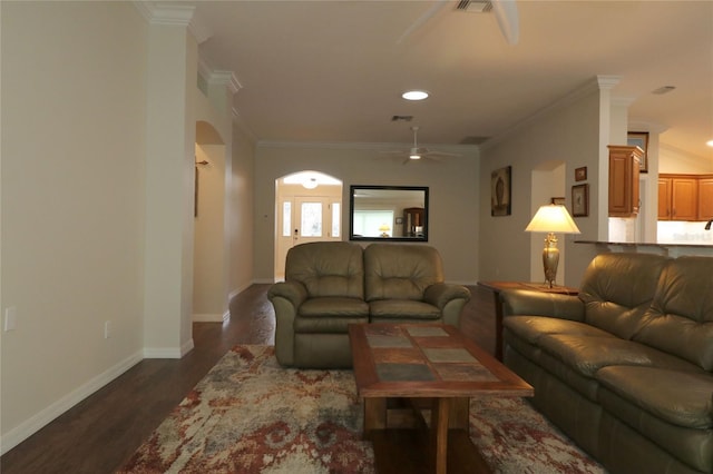 living room featuring crown molding, ceiling fan, and dark hardwood / wood-style flooring