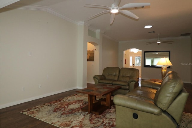 living room with ornamental molding, ceiling fan, and dark hardwood / wood-style flooring