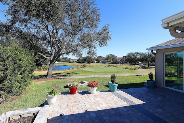 view of patio with a water view