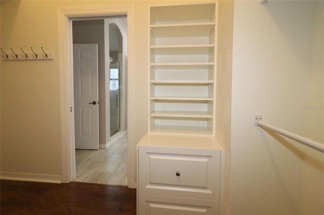 walk in closet featuring dark hardwood / wood-style floors