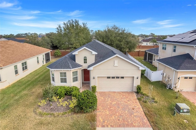 front of property featuring a garage and a front lawn