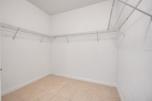 spacious closet with tile patterned flooring