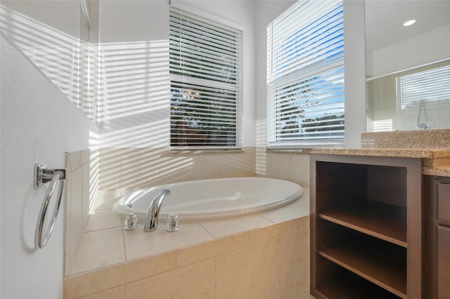 bathroom featuring vanity and separate shower and tub