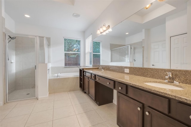 bathroom with vanity, tile patterned floors, and shower with separate bathtub