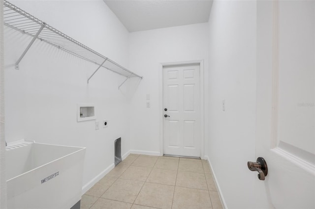 laundry area with light tile patterned flooring, electric dryer hookup, sink, and washer hookup