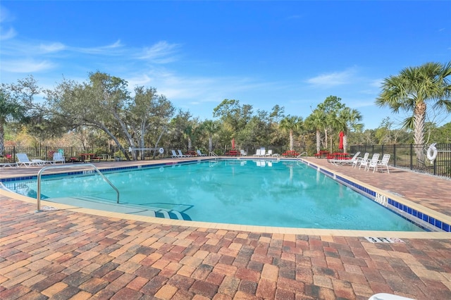 view of swimming pool with a patio area