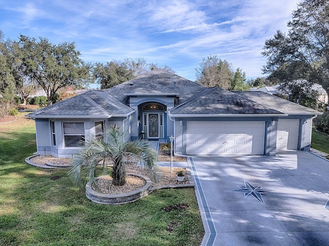 single story home with a garage and a front lawn