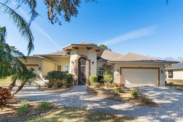 mediterranean / spanish-style house featuring a garage