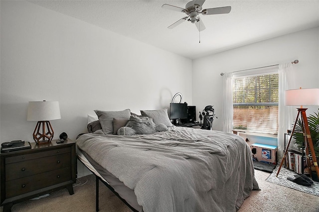 bedroom with ceiling fan and light carpet