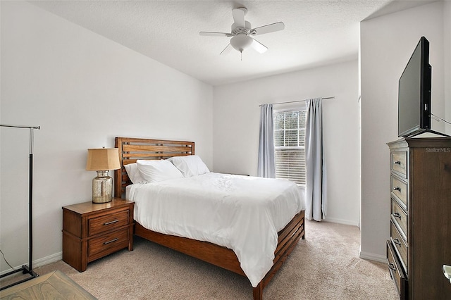 bedroom featuring light colored carpet and ceiling fan