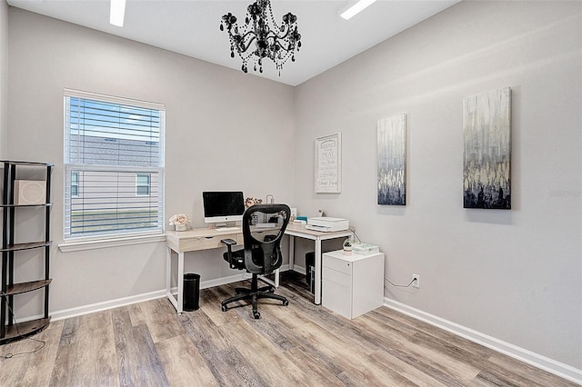 office with light wood-type flooring