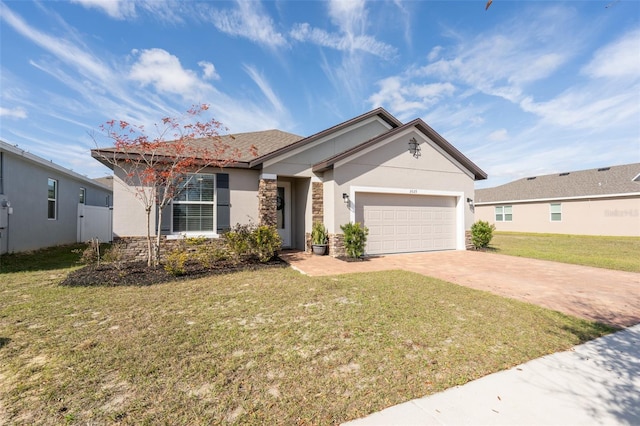 ranch-style home featuring a garage and a front yard