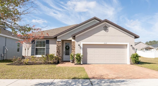 single story home with a garage and a front yard