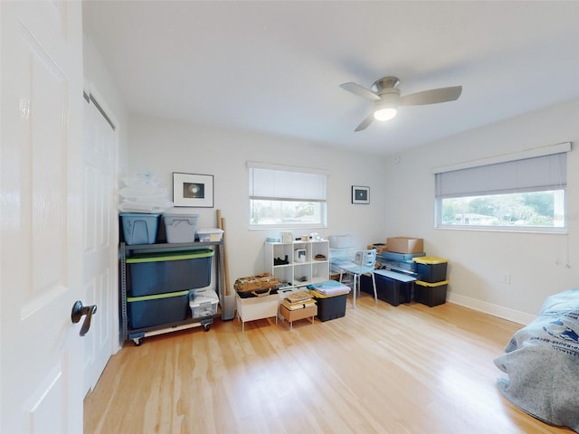 interior space featuring hardwood / wood-style floors and ceiling fan