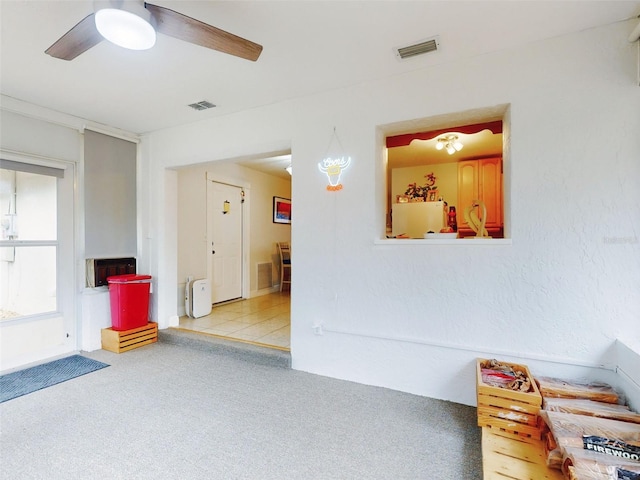 interior space featuring ceiling fan