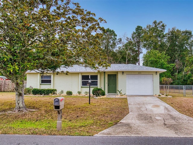 ranch-style home featuring a garage and a front lawn