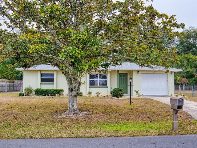 view of front facade with a garage and a front lawn