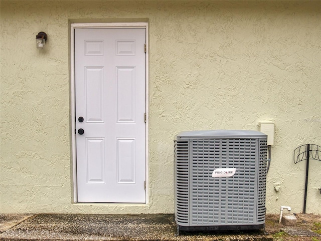 entrance to property featuring central AC unit