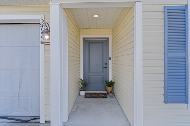 entrance to property featuring a garage