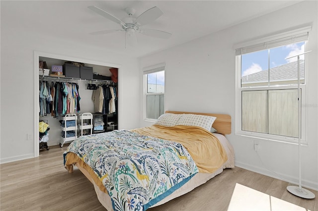 bedroom featuring ceiling fan, a closet, and wood-type flooring