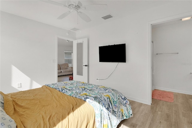 bedroom featuring ceiling fan and light hardwood / wood-style flooring