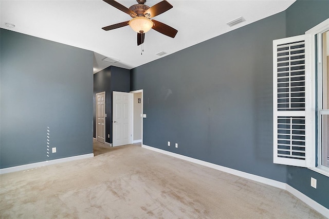 carpeted empty room with ceiling fan