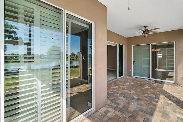 exterior space featuring ceiling fan